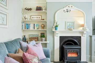 The electric wood-burner effect stove adds warmth throughout the seasons.