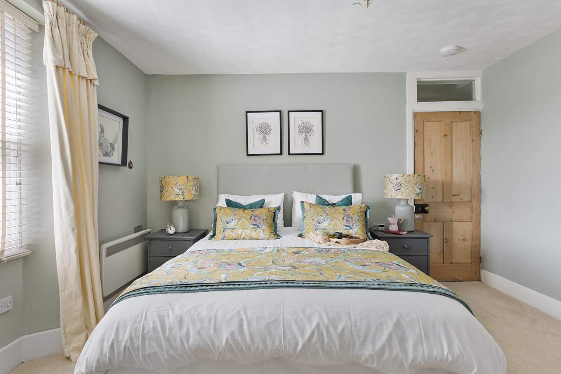 The double bedroom with king-size bed and luxury linens is exquisite.