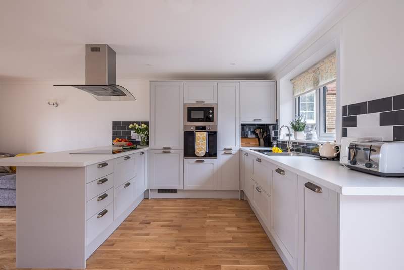 A sociable kitchen with plenty of workspace to cook your favourite meals.