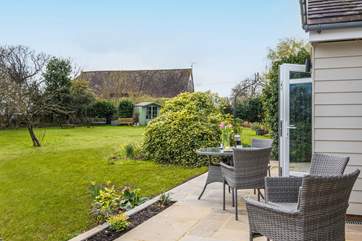 The private patio with access to the gardens that are shared with the owner.