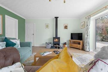 The spacious sitting/dining-room has a warming wood-burner to keep you cosy throughout the year.
