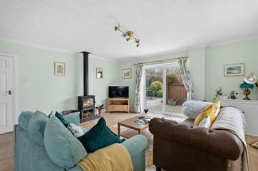 Welcome to Stable Cottage, the perfect holiday retreat. The gorgeous sitting/dining-room has patio doors leading out into the garden.