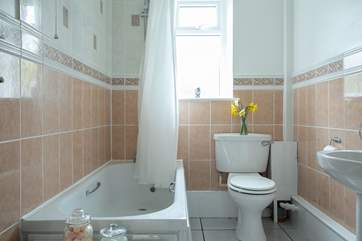 The family bathroom has a bath with a shower over giving you the best of both worlds.