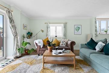 Comfy sofas invite you to kick back and relax.