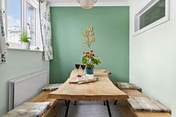 The dining-area has a fabulous hand-crafted table.