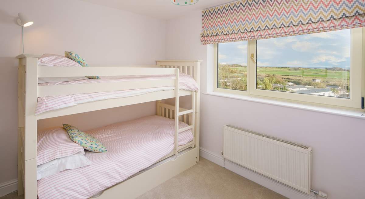 The bunk-bed bedroom has the most dreamy view. Imagine waking to this every morning!