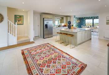 The open plan kitchen/diner is perfect for a large family gathering. Climb the stairs to the gorgeous bedrooms. 