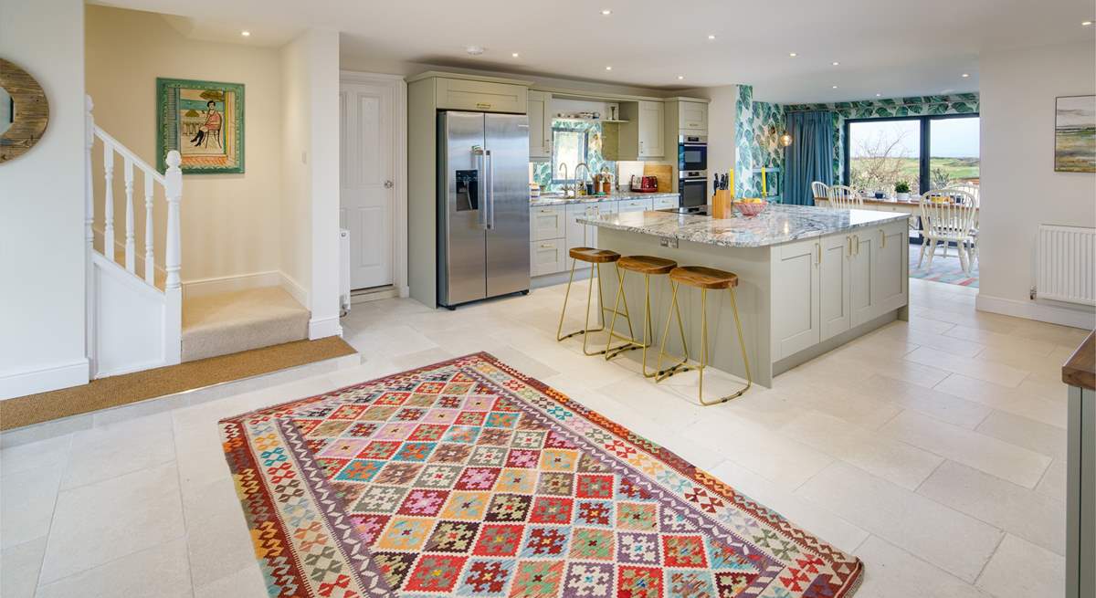 The open plan kitchen/diner is perfect for a large family gathering. Climb the stairs to the gorgeous bedrooms. 