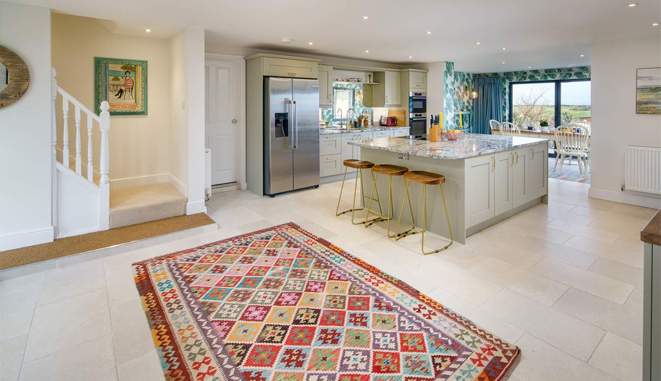 The open plan kitchen/diner is perfect for a large family gathering. Climb the stairs to the gorgeous bedrooms. 