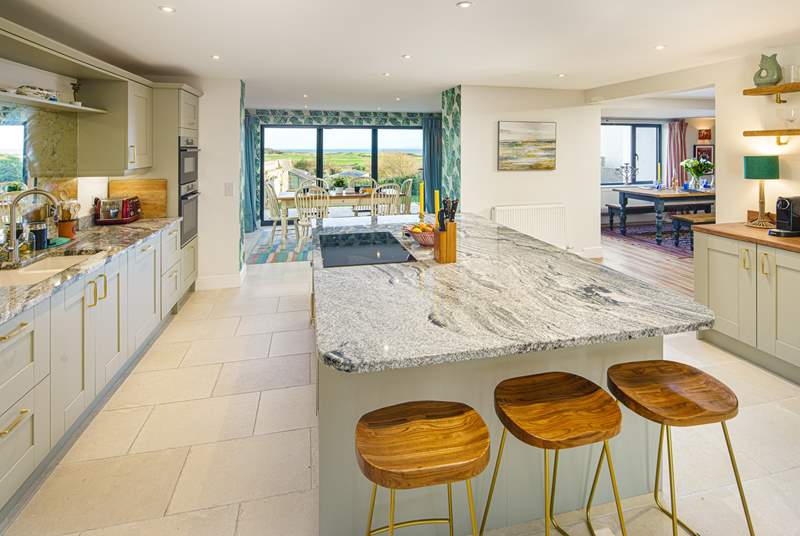 The stylish open plan kitchen/diner has magical views.
