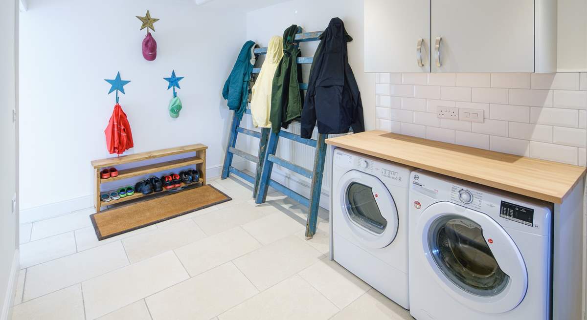 Off the kitchen, a handy utility-room is great for storage of outdoor holiday kit.