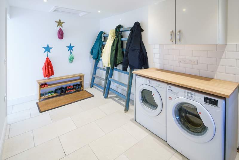 Off the kitchen, a handy utility-room is great for storage of outdoor holiday kit.