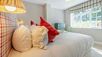 The ground floor super-king room has views over the pretty village green.