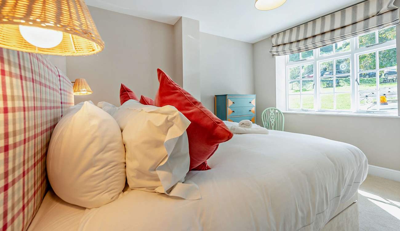 The ground floor super-king room has views over the pretty village green.