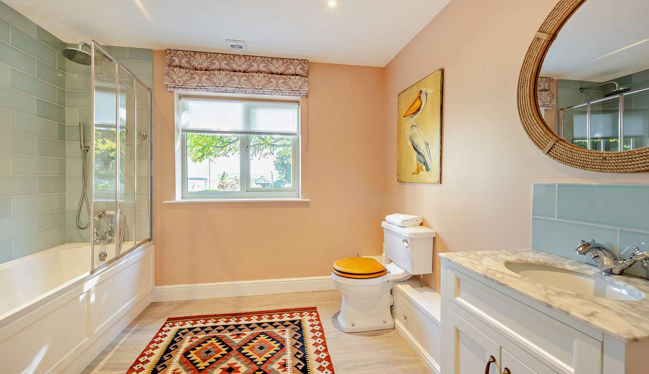 This gorgeous bathroom is perfect for a long soak after a busy beach day or a refreshing morning shower.