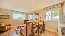 The second open plan living-area on the ground floor has a TV and lovely views...