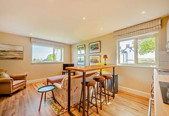 The second open plan living-area on the ground floor has a TV and lovely views...