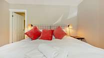 Bedroom 1 on the ground floor has a super-king bed and the bathroom is just next door, with bath and separate shower. 