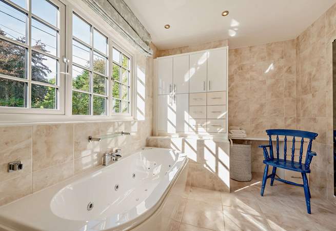 The spacious family bathroom with separate shower cubicle. 