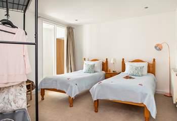 The twin bedded room is an internal room but the large glass panel gives the room plenty of light