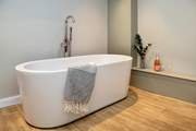 Treat yourself to a leisurely soak in this gorgeous bath - bubbles are an optional extra!