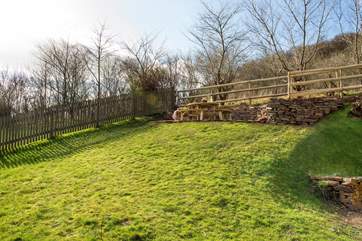 The dining terrace is set at the top of the garden