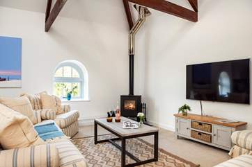 The huge TV is perfect for watching a holiday film together