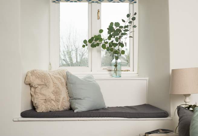 Take a pew at the window to look out across the garden.