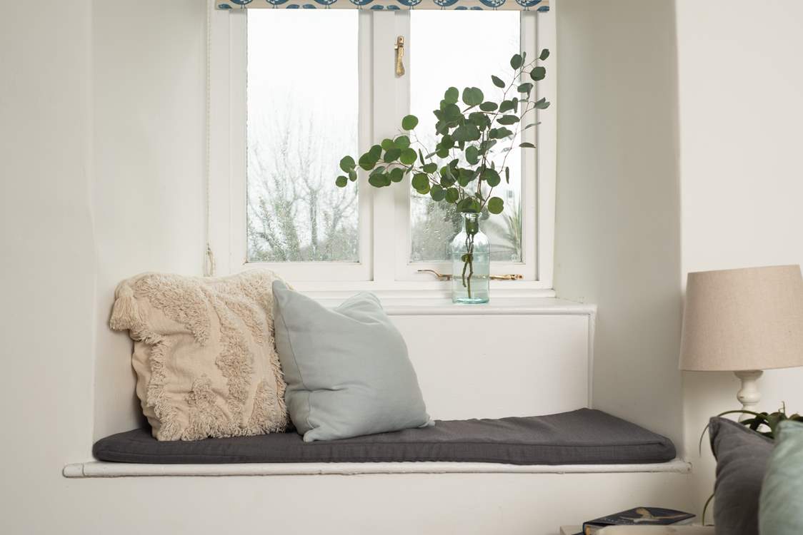 Take a pew at the window to look out across the garden.