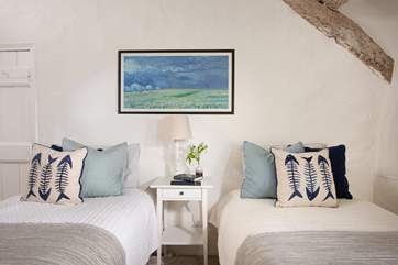 Bedroom three is set up with twin beds