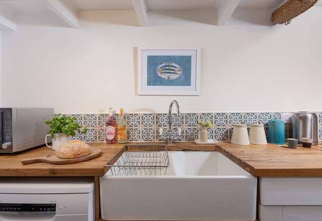 The kitchen has a proper country-style sink.
