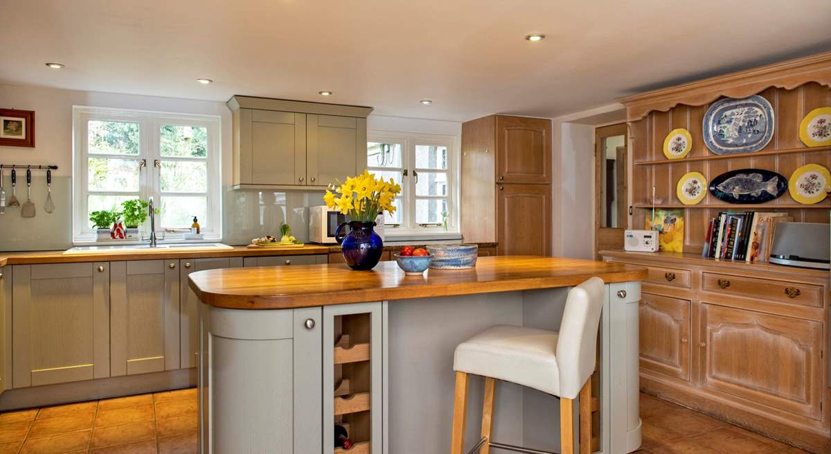 Take a pew at the kitchen island to keep the designated cook company.