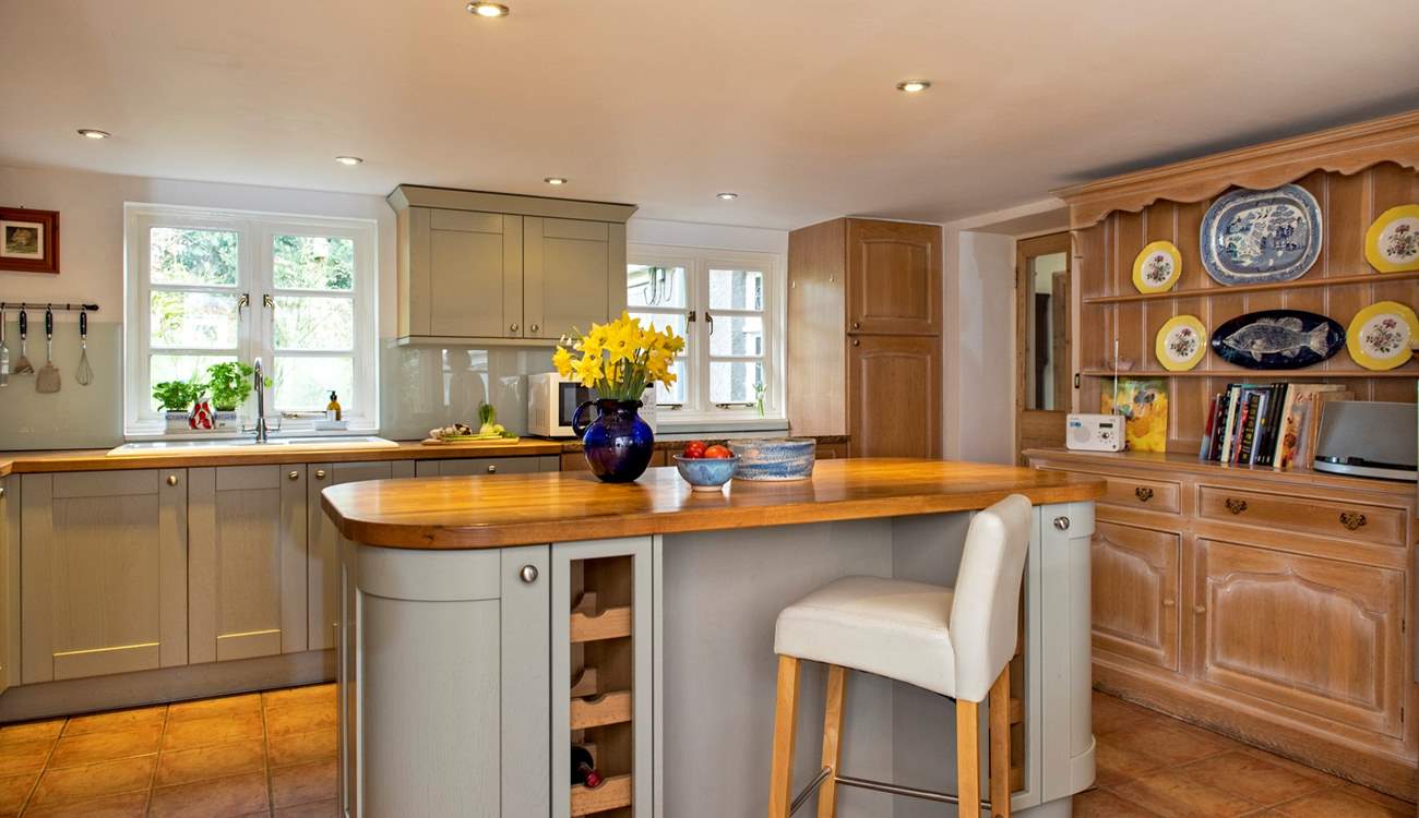 Take a pew at the kitchen island to keep the designated cook company.