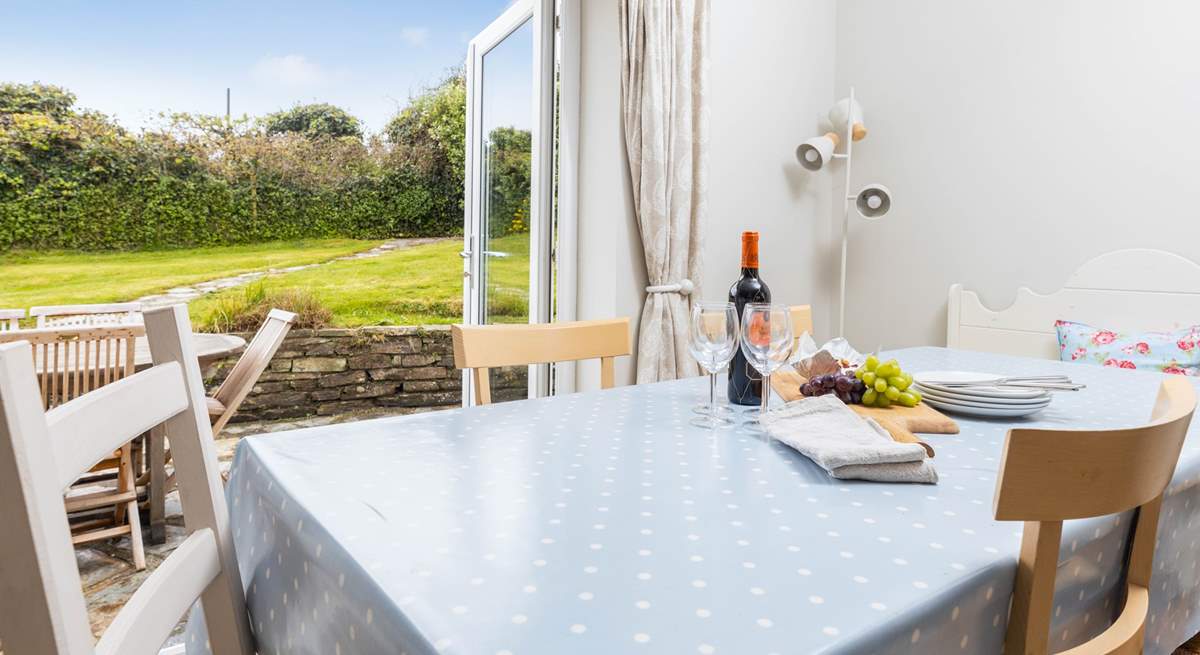 Patio doors lead out into the secluded back garden where you can catch the sun's rays all day.