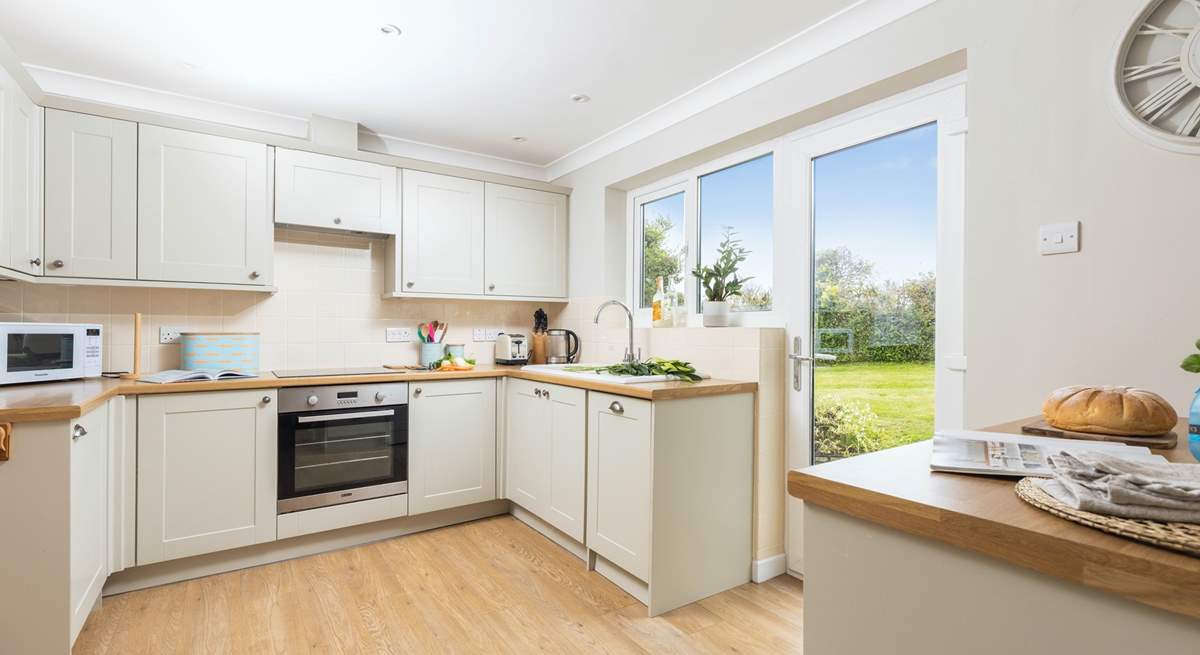 The kitchen has easy access to the rear garden and sits next to the dining-table for super sociable meals.