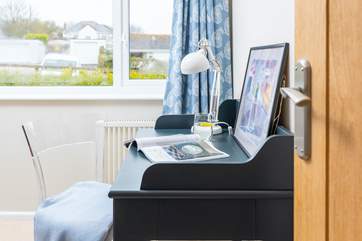 The desk in the single bedroom is perfect if work calls.