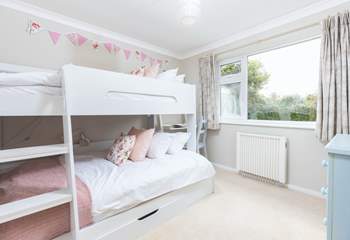 Children will love the cute bunk-room with a lower four-foot bed and three-foot bed above.