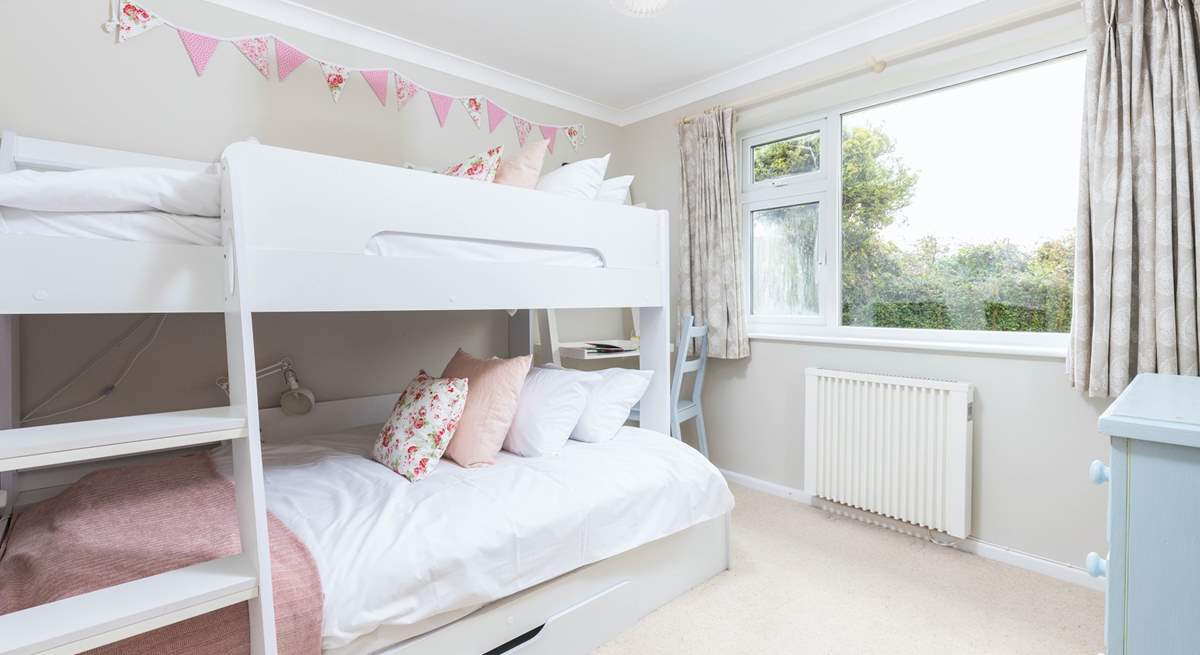 Children will love the cute bunk-room with a lower four-foot bed and three-foot bed above.