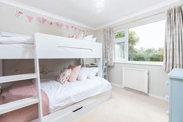 Children will love the cute bunk-room with a lower four-foot bed and three-foot bed above.