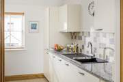 The kitchen has all you will need, including the all-important dishwasher.