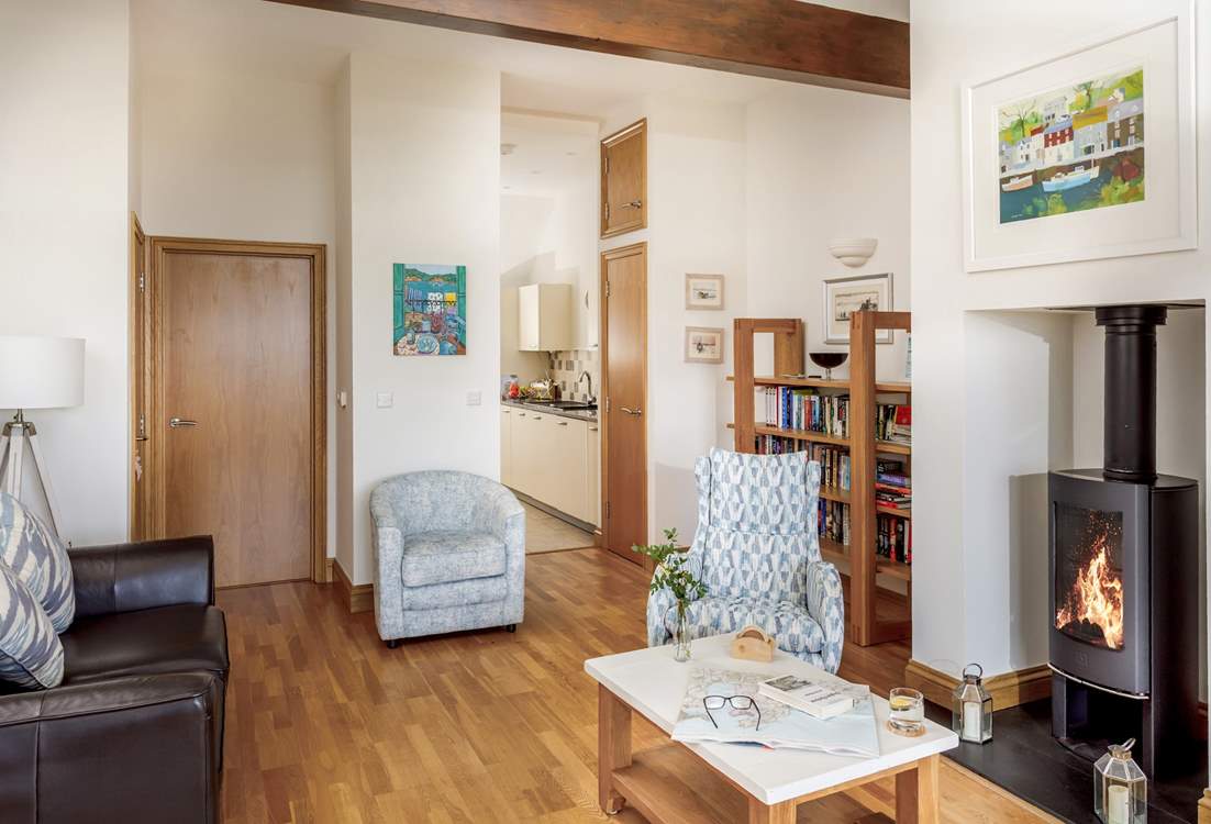 The open plan living space on the first floor is beautifully furnished.