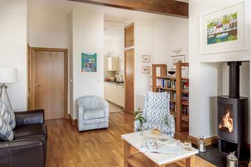 The open plan living space on the first floor is beautifully furnished.