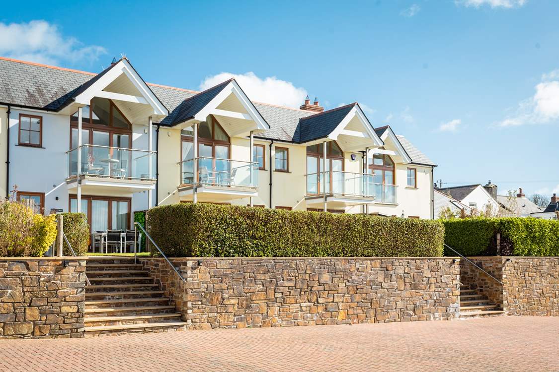 Steps lead up from the convenient parking at Creek View to the front garden.