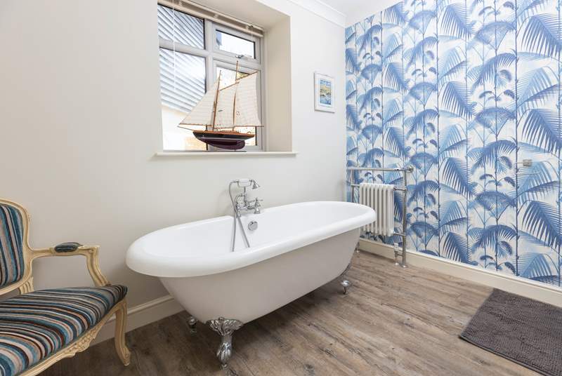 The fabulous roll-top bath in the second bathroom is the perfect place for a long soak.