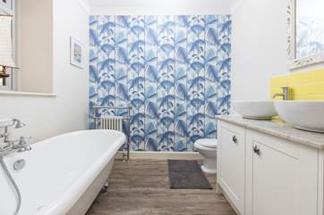 This bright and cheerful bathroom even has twin sinks.