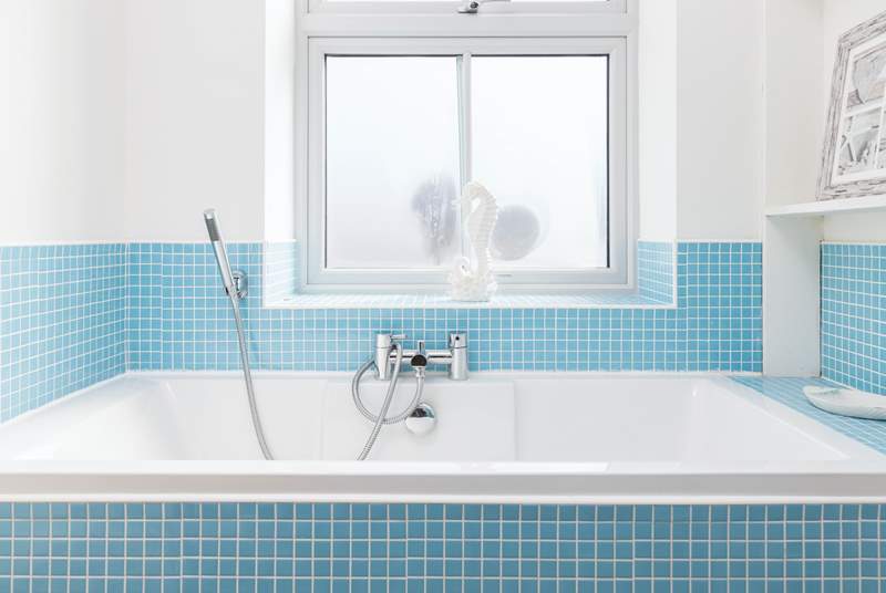 The fabulous bath in bathroom 1 has a hand shower attachment and also a separate shower cubicle.