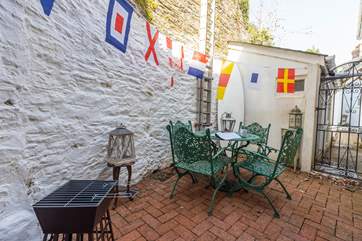 Light the barbecue and enjoy al fresco dining on the rear patio.