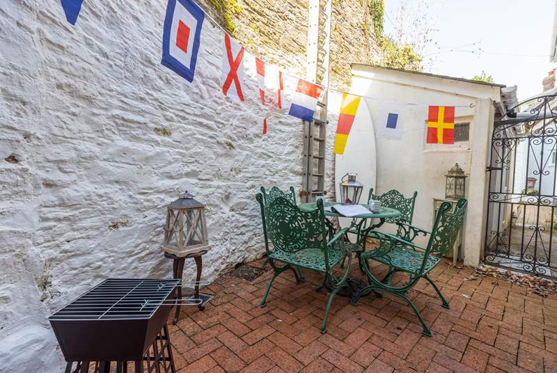 Light the barbecue and enjoy al fresco dining on the rear patio.