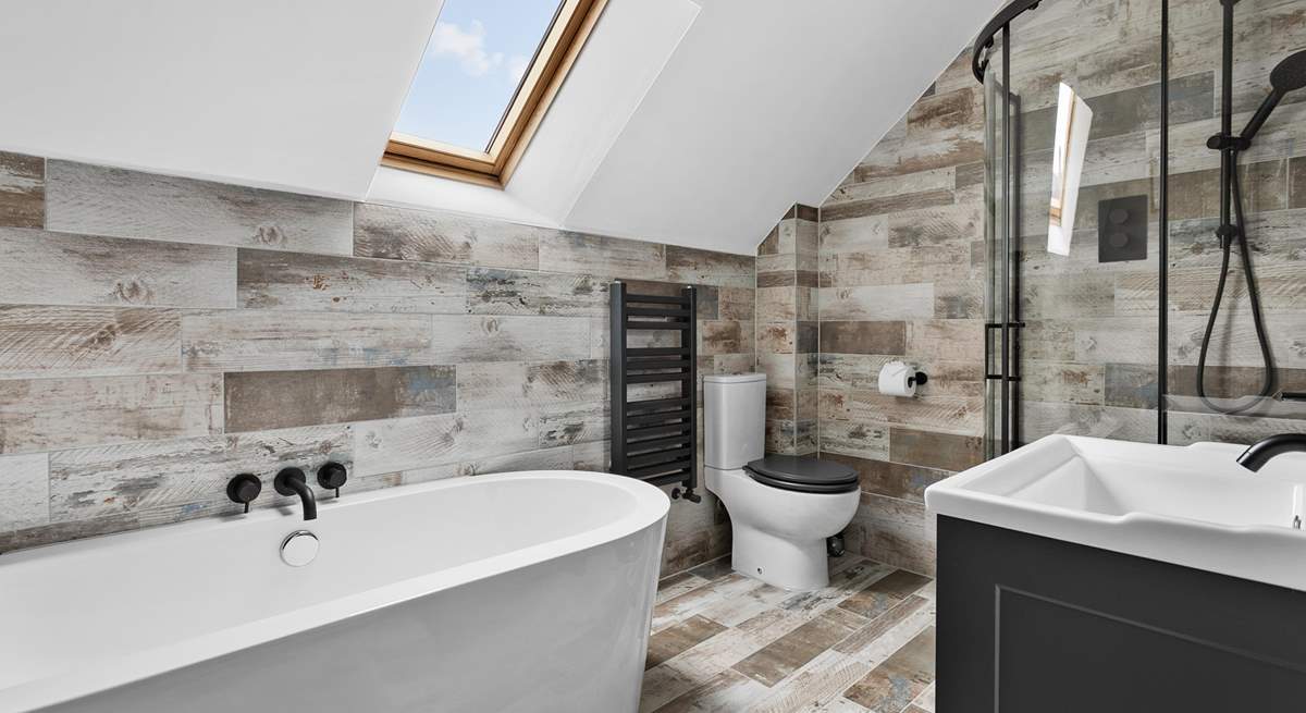 The gorgeous family bathroom is perfect for a long soak or a refreshing shower after a busy day.