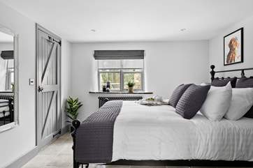 Bedroom 1 on the ground floor is elegantly furnished.